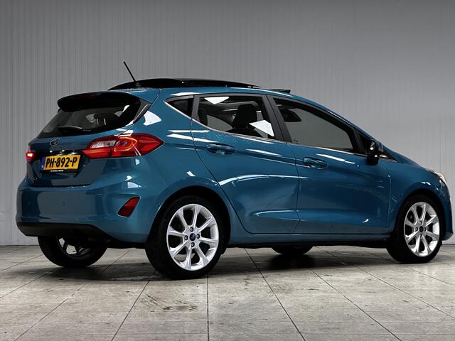 Ford FIESTA 1.0 EcoBoost Titanium/ DEALER ONDERHOUDEN!/ B&O/ Camera/ 17'' LMV/ Keyless/ Lane-Assist./ Panorama-Dak/ PDC V+A/ Chroom/ Apple + Android/ DAB+/ Navi/ Clima/ Cruise/ Multi. LEDER. Stuur/ Mistl.