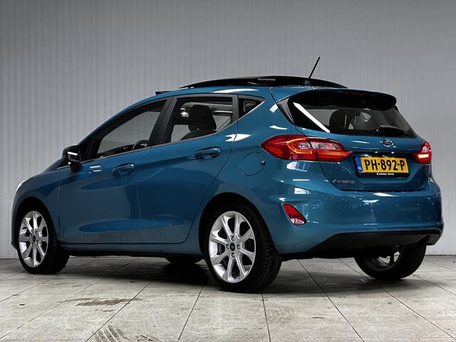 Ford FIESTA 1.0 EcoBoost Titanium/ DEALER ONDERHOUDEN!/ B&O/ Camera/ 17'' LMV/ Keyless/ Lane-Assist./ Panorama-Dak/ PDC V+A/ Chroom/ Apple + Android/ DAB+/ Navi/ Clima/ Cruise/ Multi. LEDER. Stuur/ Mistl.