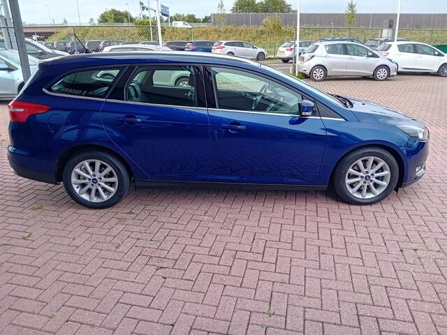 Ford FOCUS Wagon 1.5 Titanium Automaat 150 PK, Airco(automatisch), Multimediasysteem, Carplay/Android auto, Navigatie, Camera, Parkeersensoren, Parkeerhulp, Cruise control, Stoelverwarming, Verwarmd stuurwiel, Verwarmde voorruit, Keyless, Half lederen bekleding, Tre