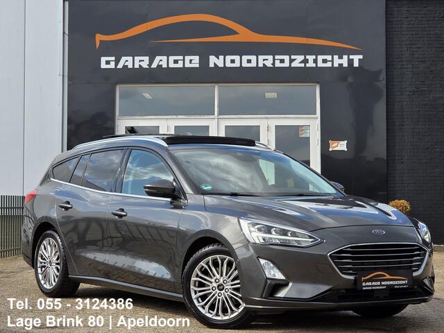 Ford FOCUS Wagon 1.0 EcoBoost Titanium Business PANORAMADAK|NAVIGATIE|CRUISE CONTROL|CAMERA|KEY LESSGO|BANG&OLUFSEN| MUZIEK|PDC VOOR+ACHTER|GETINT GLAS|ELEKTRISCHE KLEP|17 INCH Maandag tot Vrijdag geopend van 09.00 tot 20.00 uur geopend en Zaterdag van 09.00 tot 18.