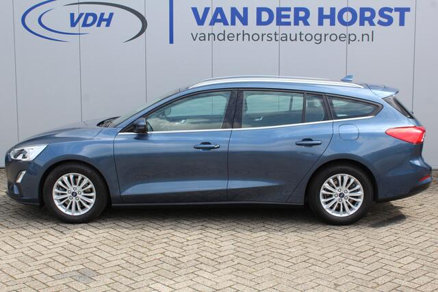 Ford FOCUS Wagon 1.0-125pk EcoBoost Titanium Business. Ruime, zeer geschikte gezinsauto ! Autm. airco dual, stoel-, stuur- en voorraamverw., LM wielen, trekhaak, metallic lak, navigatie, telefoonvoorb., cruise control etc