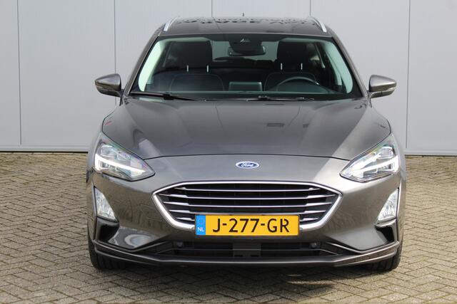 Ford FOCUS Wagon 1.0-125pk EcoBoost Titanium Business. Uiterst nette, comfortabele en ruime stationcar. Stoel-, stuur- en voorraamverw., Trekhaak, B&O soundsyst, lane assist, adaptieve cruise cntrl, camera a, LM wln, navigatie, telefoonvoorb. etc