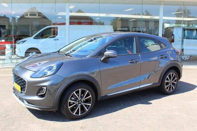 Ford PUMA 1.0-125pk EcoBoost Hybrid Titanium. Garantie t/m 21-05-2027 ! Slechts 14.750km ! Volautm. airco, metallic lak, stoel-, stuur- en voorraamverwarming, navigatie, telefoonvoorbereiding, elektrische achterklep, cruise cntrl, keyless entry / keyless go etc.