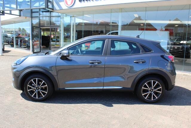 Ford PUMA 1.0-125pk EcoBoost Hybrid Titanium. Garantie t/m 21-05-2027 ! Slechts 14.750km ! Volautm. airco, metallic lak, stoel-, stuur- en voorraamverwarming, navigatie, telefoonvoorbereiding, elektrische achterklep, cruise cntrl, keyless entry / keyless go etc.