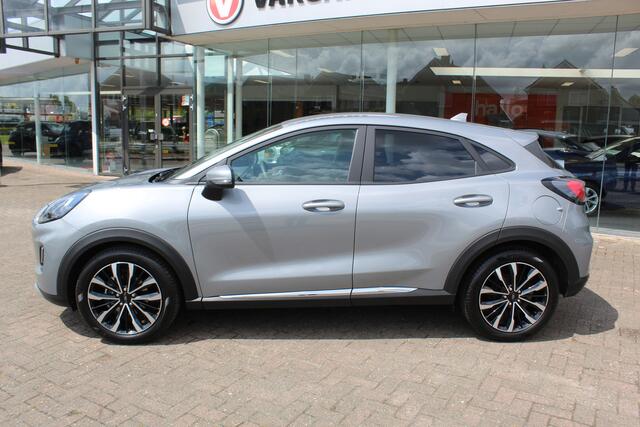 Ford PUMA 1.0-125pk EcoBoost Mild-Hybrid Titanium X. Garantie t/m 07-03-2028 ! Slechts 7.400km ! Cruise cntrl, climate cntrl, stoel-, stuur- en voorraamverw., draadloos opladen telefoon, trekhaak afneembaar, navigatie, telefoonvoorb., LM wielen, B&O soundsyst., dig