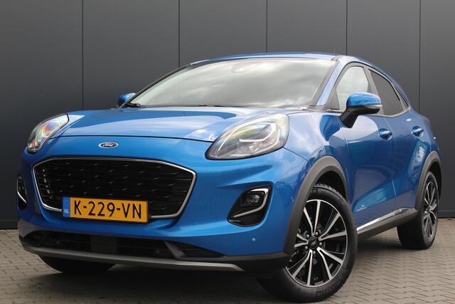 Ford PUMA 1.0 EcoBoost Titanium | Incl. 12 maanden garantie | Trekhaak | Dodehoek detectie | Cruise control | Apple Carplay/Android auto | Lichtmetalen velgen | Elektrische kofferklep | DAB | Airco | Climate control | Navigatie