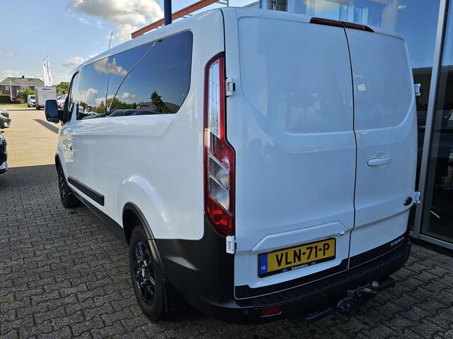 Ford TRANSIT CUSTOM 300 2.0 TDCI L2H1 Trail | Glasslook panelen | Raptor grille | Camera | Trekhaak | Leder | Voorruitverwarming | Airco | Cruise control etc.