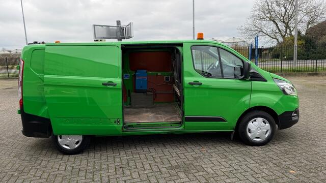 Ford TRANSIT CUSTOM 2.0 TDCI 77KW 105PK L2H1 EURO 6 AIRCO/ NAVIGATIE/ CRUISE CONTROL/ TREKHAAK/ 100% DEALERONDERHOUDEN