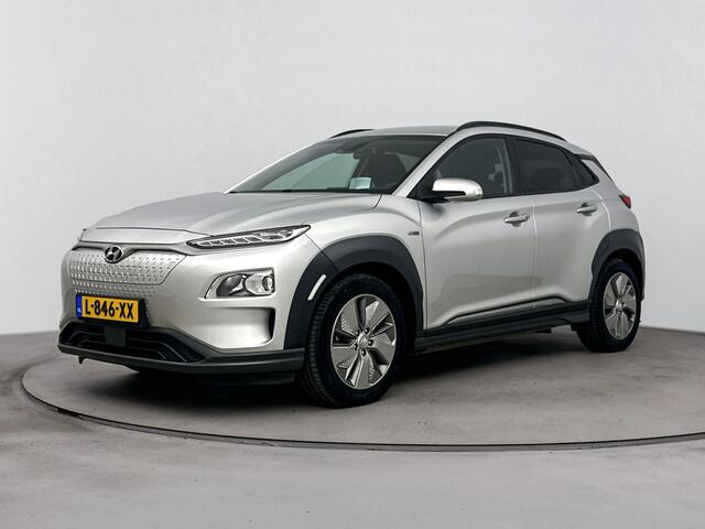 Hyundai Kona EV Fashion 64 kWh | Warmte pomp | Navigatie | Dodehoek detectie | Parkeersensor achter | Apple Carplay Android Auto |