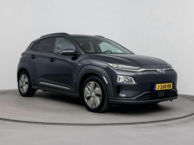 Hyundai Kona EV Fashion 64 kWh | Dodehoek detectie | Parkeersensoren achter en Camera | Warmtepomp | Soh 96,6% |