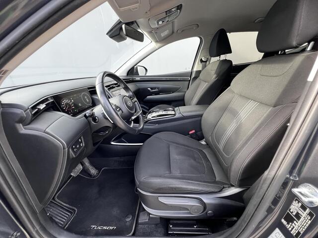 Hyundai TUCSON 1.6 T-GDI HEV Comfort Smart Automaat / Fabrieksgarantie tot 02-2028 ** / Dealer onderhouden / Navigatie / Achteruitrijcamera / Stuur- en stoelverwarming / Apple Carplay Android / 19" LM + All Season banden /