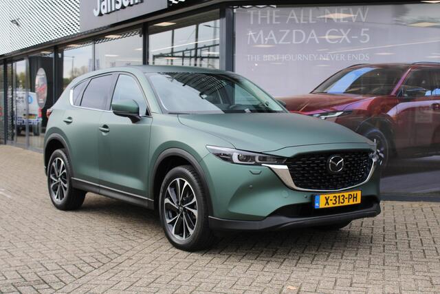 Mazda CX-5 2.0 e-SkyActiv-G M Hybrid 165 Exclusive-Line+Com.P , Automaat, Matte Metallic Pine Green gewrapped, Black Comfort Pack, Navi, Adap.Cruise, Clima, Apple Carplay, 360 Camera, PDC, HUD, Stuur/Stoelverwarming, 19" LMV