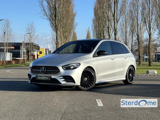 Mercedes-Benz B-KLASSE 200 AMG Line l Distronic l Panoramaschuifdak l MBUX l Achteruitrijcamera l Multispaaks l sportief motorgeluid l Keyless l Stoelverwarming l Multibeam l draadloos opladen voor l