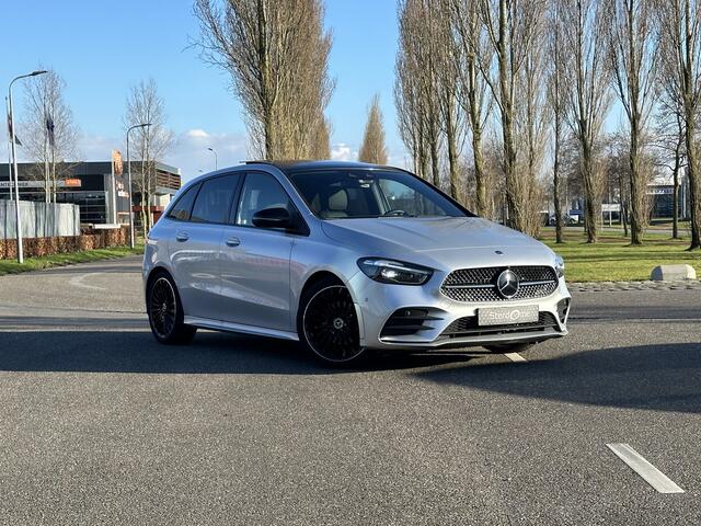 Mercedes-Benz B-KLASSE 200 AMG Line l Distronic l Panoramaschuifdak l MBUX l Achteruitrijcamera l Multispaaks l sportief motorgeluid l Keyless l Stoelverwarming l Multibeam l draadloos opladen voor l
