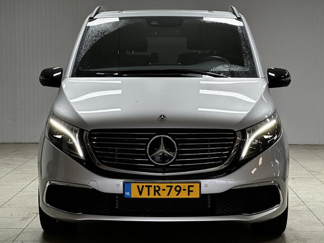 Mercedes-Benz EQV 300 L2 90kWh/ AMG Styling/ 2x Schuifdeur/ LED Koplampen/ 18'' LMV/ Vol Leder/ Elek. Kofferklep/ 360° Camera/ Sfeerverl./ Lane-Assist./ Apple + Android/ Elek. Stoelen + Memory/ Stoelverw.