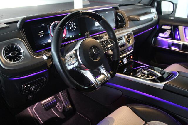 Mercedes-Benz G-KLASSE 63 AMG Night pakket/Magno matt/Panoramadak/Burmester audio/Sfeerverlichting/Entertainment schermen achter/Akrapovic/AMG active ride control/Elektrisch verstelbare stoelen met memory + massage/Stoel verwarming + koeling/360° camera/voorruitverwarming/IWC