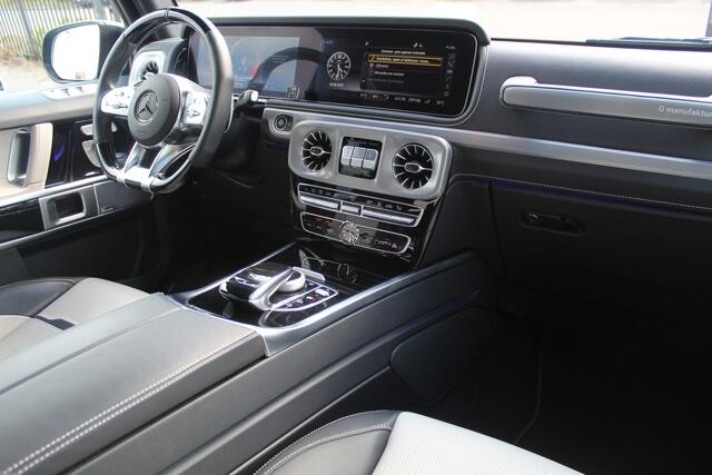 Mercedes-Benz G-KLASSE 63 AMG Night pakket/Magno matt/Panoramadak/Burmester audio/Sfeerverlichting/Entertainment schermen achter/Akrapovic/AMG active ride control/Elektrisch verstelbare stoelen met memory + massage/Stoel verwarming + koeling/360° camera/voorruitverwarming/IWC