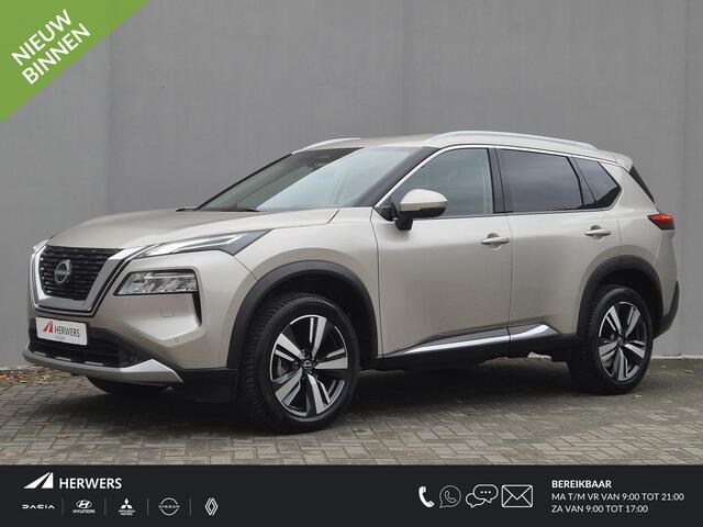 Nissan X-TRAIL 1.5 MHEV 163pk Tekna Automaat / Fabrieksgarantie tot 07-2027 / Dealer onderhouden / Allseason banden / Trekgewicht 2000 kg / HUD / Elektrische achterklep / Stuur-, Stoel en Achterbank verwarming / Rondomzicht camera /