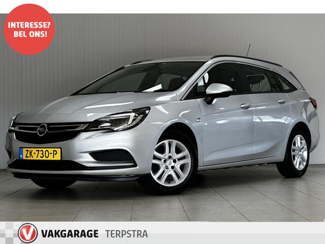 Opel ASTRA Sports Tourer 1.0 Turbo Business/ Apple + Android/ DAB+/ Navi/ Airco/ Cruise/ Elek. pakket/ Isofix/ Bluetooth/ Armsteun/ Multi. LEDER. Stuur/ PDC Achter.
