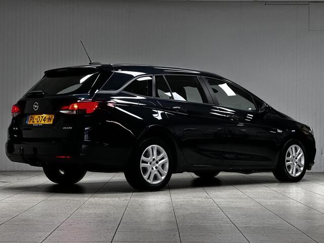 Opel ASTRA Sports Tourer 1.0 Online Edition/ Trekhaak/ Apple + Android/ DAB+/ Navi/ Airco/ Cruise/ Elek. pakket/ Isofix/ Bluetooth/ Armsteun/ Multi. LEDER. Stuur/ PDC V+a/ Dakrails/ LED Dagrijverl.