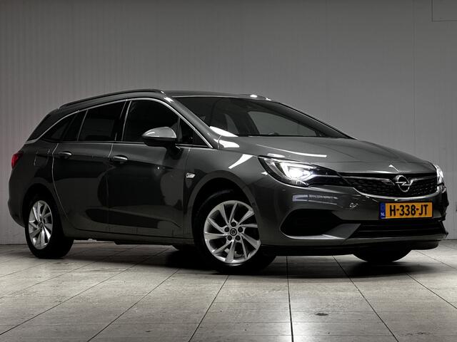 Opel ASTRA Sports Tourer 1.2 Elegance/ Trekhaak!/ LED Koplampen/ Virtual Cockpit/ Dodehoekdetectie/ Camera/ Zwarte Hemel/ Grootlichtass./ Keyless/ DAB+/ Apple+Android/ Clima/ Navi/ Cruise/ Bluetooth/ Multi.LEDER.Stuur/ Elek.Pakket