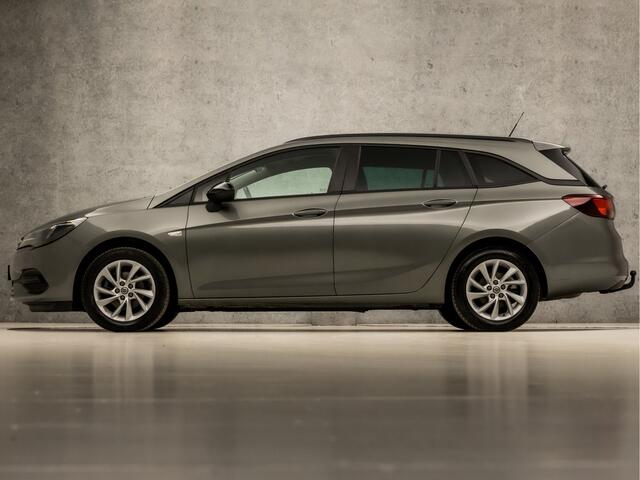 Opel ASTRA Sports Tourer 1.2 Sport (APPLE CARPLAY, NAVIGATIE, CAMERA, STUUR/STOELVERWARMING, CLIMATE, GETINT GLAS, SPORTSTOELEN, LED KOPLAMPEN, LM VELGEN, TREKHAAK, DAB+, NIEUWE APK, NIEUWSTAAT)