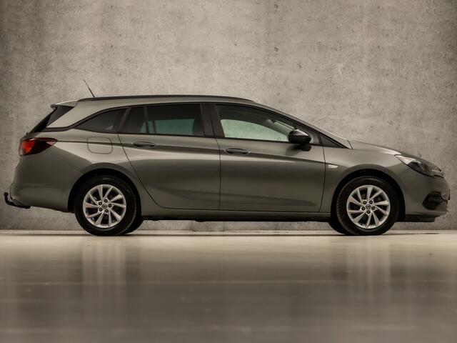 Opel ASTRA Sports Tourer 1.2 Sport (APPLE CARPLAY, NAVIGATIE, CAMERA, STUUR/STOELVERWARMING, CLIMATE, GETINT GLAS, SPORTSTOELEN, LED KOPLAMPEN, LM VELGEN, TREKHAAK, DAB+, NIEUWE APK, NIEUWSTAAT)