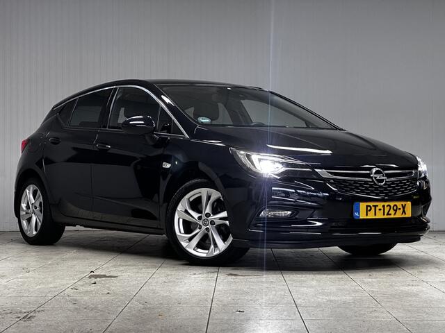 Opel ASTRA 1.6 CDTI Innovation/ 136pk!/ Trekhaak/ Sportstoelen/ 17'' LMV/ Camera/ Dode-Hoek DET./ Half-Leder/ Lane-Assist./ Keyless/ Apple + Android/ Navi/ PDC V+A/ DAB+/ Clima/ Cruise/ Multi. LEDER. Stuur/ Extra getint gla