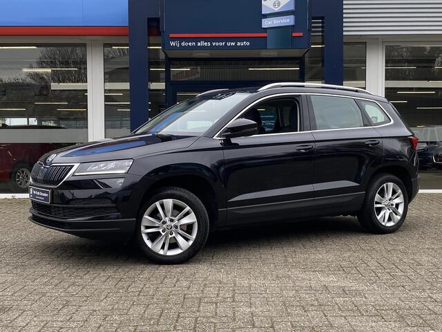 Skoda Karoq 1.0 TSI Business Edition / NL-Auto / 116 PK / 99.000 KM / 1e-Eigenaar / Vol-Leder / Trekhaak / LED-verlichting / Climate Control / Cruise Control / PDC V+A / Radio-Bluetooth-Navi / Carplay & Android auto / Draadloze telefoonlader /