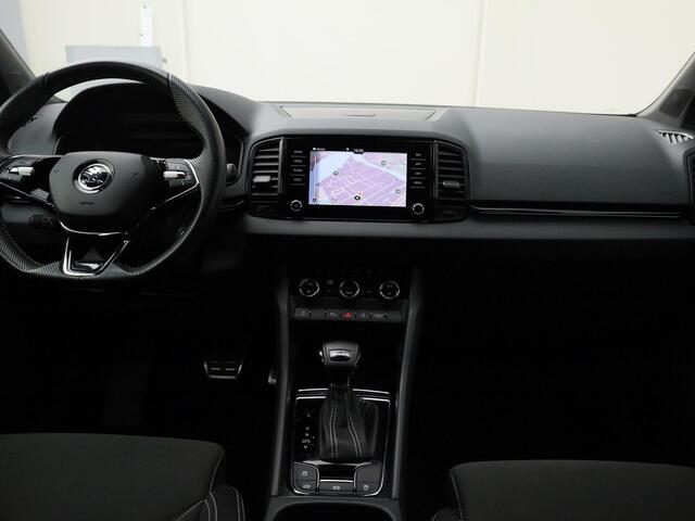 Skoda Karoq 1.5TSI/150PK ACT Sportline DSG · Navigatie · Camera + Parkeersensoren · Stoel-& stuurverwarming · Garantie tot februari 2027 of 60000km.