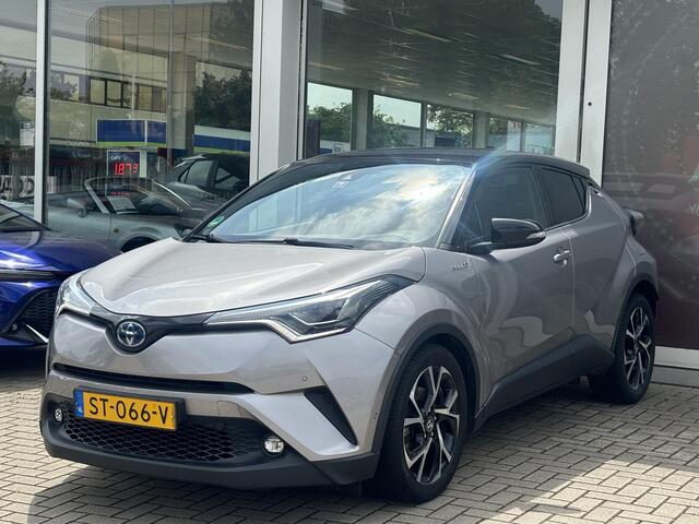 Toyota C-HR 1.8 Hybrid Bi-Tone | Leder | Stoelverwarming | Zomer + winterbanden | Parkeersensoren voor en achter | Toyota Garantie tot 2028!