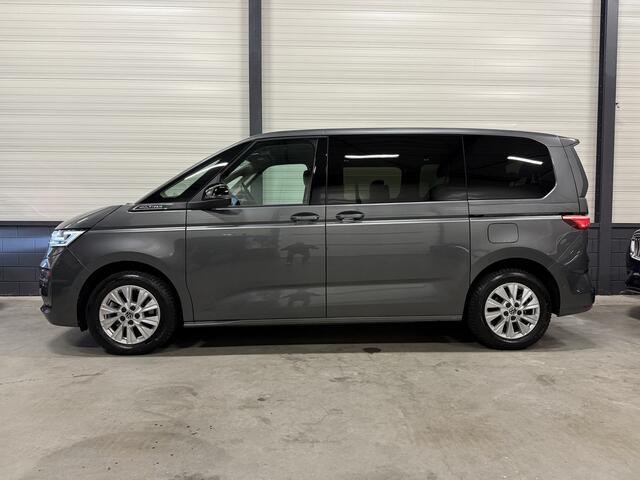 Volkswagen MULTIVAN 1.4 eHybrid Style 7p. LEER-ALCANTARA/TREKHAAK/IQ-LIGHT/EL.SCUIFDEUREN/SFEER/NAVI/CARPLAY/ADAPTIVE CRUISE/CHROOMSTRIP EXTERIEUR/PRIVACY/INDIUMGRAU-METALLIC/BOUWJAAR 04-2023/BTW-AUTO, PRIJS IS INCL. BTW
