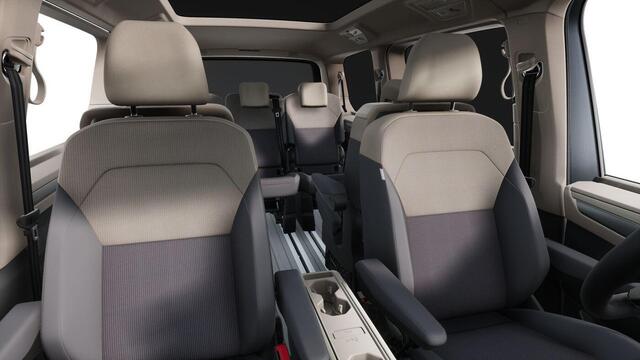 Volkswagen MULTIVAN Bulli L2 1.5 Ehybrid 180kW 245 pk DSG 4 motion | Versterkte kunststof vloerbedekking in houtlook | Multifunctionele verschuifbare tafel in passagiersruimte | Navigatiesysteem '' Discover Pro'' | Privacy Plus glas (90%) vanaf B-stijl |