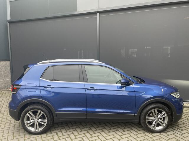 Volkswagen T-Cross automaat 1.5 TSI Style Business R design automaat Airco - Cruise control - Parkeersensoren voor en achter - Navigatie - Dakrails - Bluetooth - Dodehoek detector - Stuur leder - Stuur multifunctioneel - Start/stop systeem - Radio - Licht metalen velgen 17 