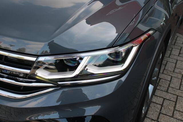 Volkswagen TIGUAN 1.4 TSI 245PK eHybrid R-LINE BUSINESS + | PANORAMISCH SCHUIF/KANTEL DAK | ELEKTRISCH WEGKLAPENBARE TREKHAAK | R-LINE INTERIEUR/EXTERIEUR | VERWARMBARE VOORSTOELEN/STUUR | ELEKTRISCH BEDIENBARE VOORSTOELEN MET GEHEUGEN FUNCTIE | AKOESTISCH GLAS GETINT | KE